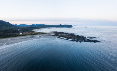 Aerial Panoramic Landscape View of Pacific Ocean Coast in Washington State. Taken during a vibrant sunrise.