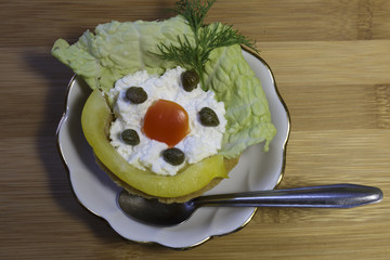 Crispy tartlets with salad from cottage cheese, vegetables and capers. White dish. Wooden background.