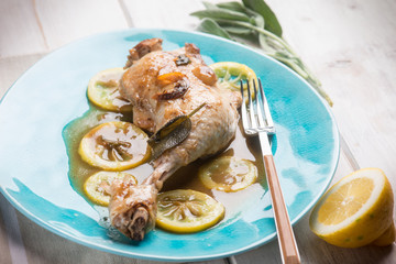 roasted chicken leg with lemon sauce, selective focus