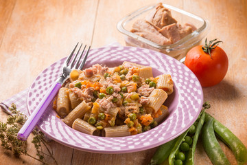 pasta with tuna tomatoes and green peas, selective focus