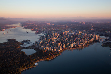 Aerial view of Downtown City during a colorful and vibrant sunset. Taken in Vancouver, British Columbia, Canada. - obrazy, fototapety, plakaty
