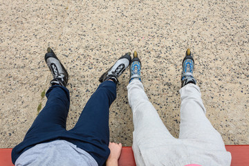 People friends relaxing with roller skates.