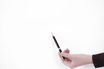 hand of business woman pointing with pen at a point on the blank screen