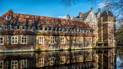 Fototapeta premium Senden, Coesfeld, Musterland December 2017 - Watercastle Wasserschloss Schloss Senden during sunny day in Winter