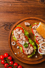 Delicious tuna sandwich, served with lettuce, tomato and onion.