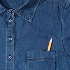 close-up view of stylish denim shirt with pencil in pocket