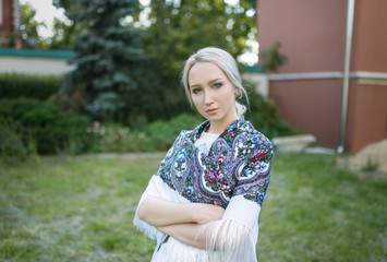 Outdoors portrait of beautiful young woman in the park. Selective focus.