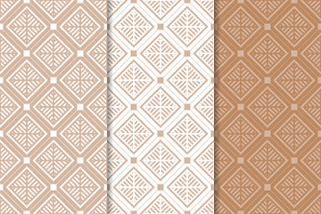 Set of geometric ornaments. Brown and white seamless patterns