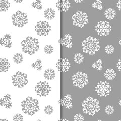 White and gray floral ornaments. Set of seamless backgrounds