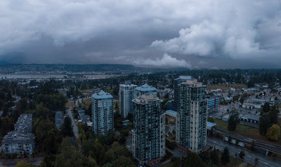 Fototapeta na wymiar Aerial panoramic view of Surrey City in Greater Vancouver, British Columbia, Canada. Taken during a rainy evening.