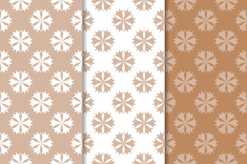 Brown floral backgrounds. Set of seamless patterns