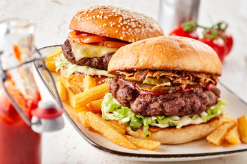 Two assorted burgers on crusty toasted buns