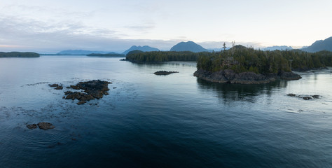 Aerial panoramic landscape view of the rocky Pacific Ocean Coast during a vibrant summer morning. Taken in Ucluelet, Vancouver Island, British Columbia, Canada.
