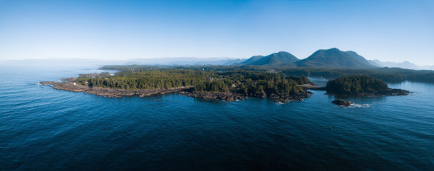 Aerial panoramic landscape view of the rocky Pacific Ocean Coast during a vibrant summer morning. Taken in Ucluelet, Vancouver Island, British Columbia, Canada.
