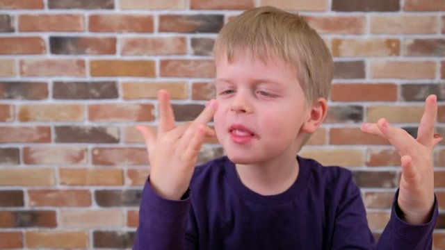 Child licks a chocolate glaze with your finger