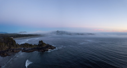 Aerial panoramic view of the beautiful Pacific Ocean Coast during a vibrant summer sunset. Taken near Tofino, Vancouver Island, British Columbia, Canada.
