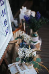 Closeup shot of the rustiс wedding decoration elements  at daylight