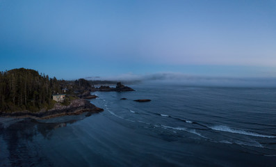 Aerial panoramic view of the beautiful Pacific Ocean Coast during a vibrant summer sunset. Taken near Tofino, Vancouver Island, British Columbia, Canada.

