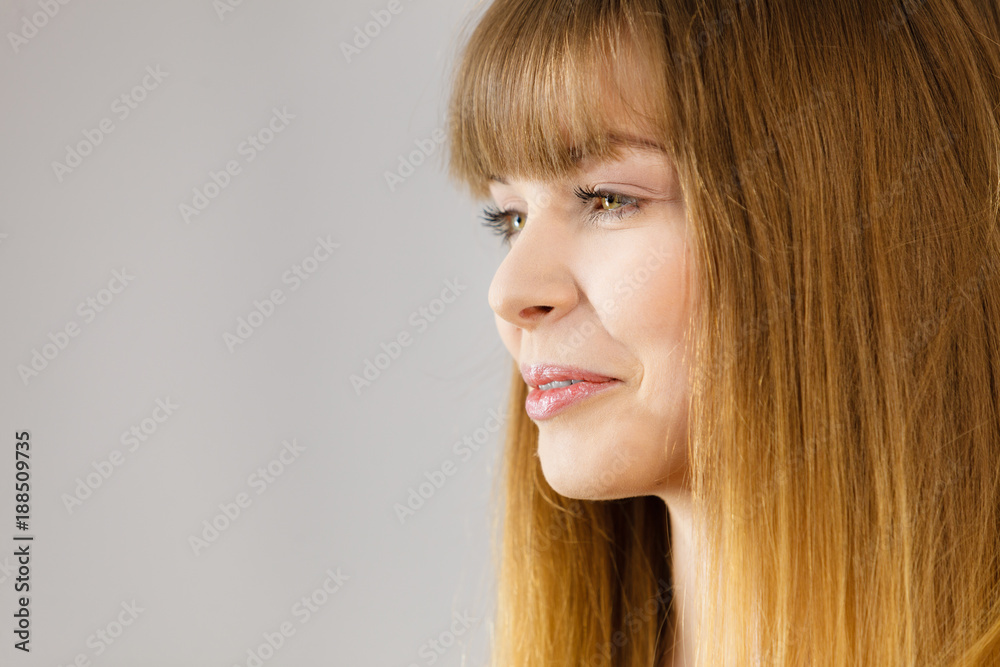 Wall mural portrait of happy blonde woman smiling with joy