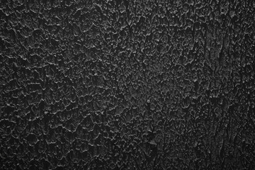 plaster stucco black wall background, grunge rough ragged texture
