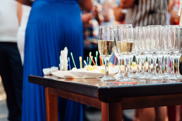 Wedding glasses filled with champagne at banquet
