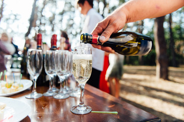 Wedding glasses filled with champagne at banquet