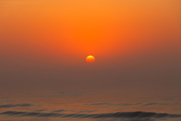 Beatiful red sunset over sea surface