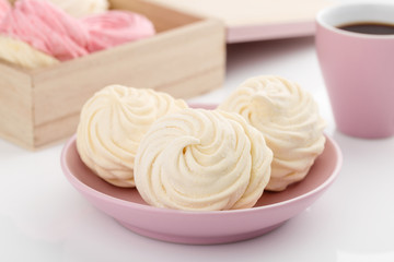 Homemade zephyr or marshmallow with coffee on white background