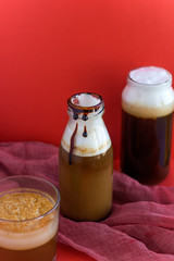 types of cold coffee on red background