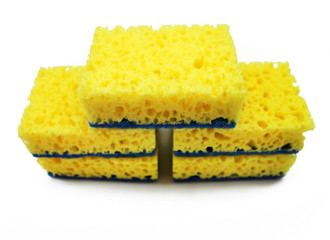 Yellow sponge for washing dishes isolated on white background.