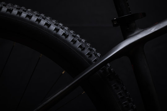 Modern MTB race mountain bike isolated on black background in a studio