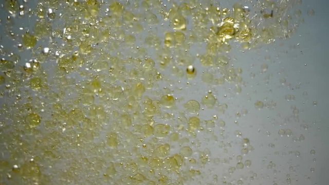 Pouring oil into the water.
