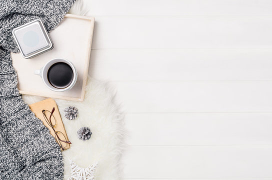 Mug With Coffee And Home Decor On White, Cosy Wooden Table Background. Winter Morning Relax Concept, Top View. Frame With Cup And Copy Space Around Objects.