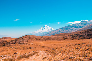 Mountain scenery. Meadows and snow-capped mountains