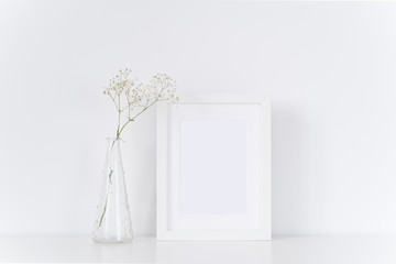 White frame with bouquet of baby's breath