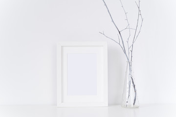 White frame with twigs