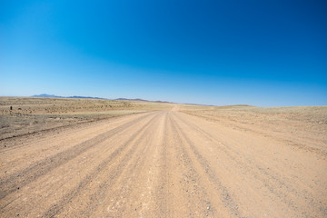 Fototapeta na wymiar Road trip in the Namib desert, Namib Naukluft National Park, travel destination in Namibia. Travel adventures in Africa.