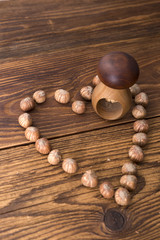 .hazelnuts and nutcracker on a wooden background