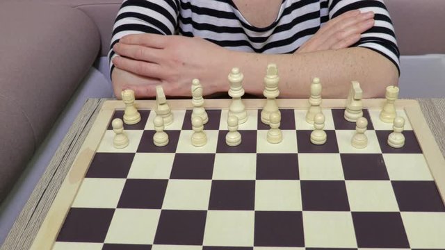 Woman in chess make a move ahead with pawn 
