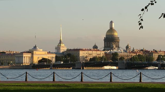 Embankment of the Neva river and the Admiralty, Isaac's Cathedral and Palace Bridge in the evening in the summer - St. Petersburg, Russia