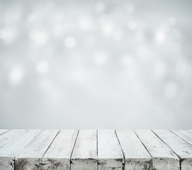 White wood table top on blurred white bokeh background