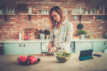 Cheerful woman on a modern kitchen