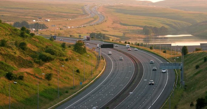 Cars & Lorries On M62 Motorway & Booth Wood Resrvoir; M62 And Reflections; West Yorkshire, England