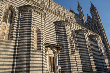 Fototapeta na wymiar Orvieto (Umbria, Italy), side of the medieval cathedral, or Duomo
