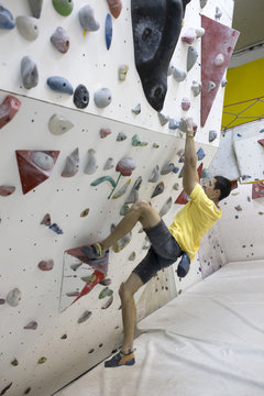 Indoor rock climbing man