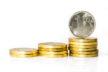 one Russian ruble with pile of Russian coins