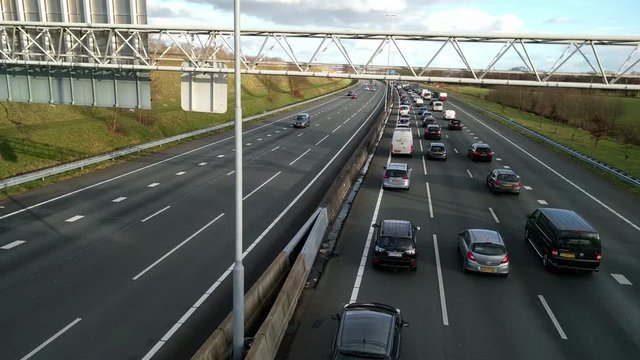 Slow commuter traffic on Dutch highway A12, traffic jam.