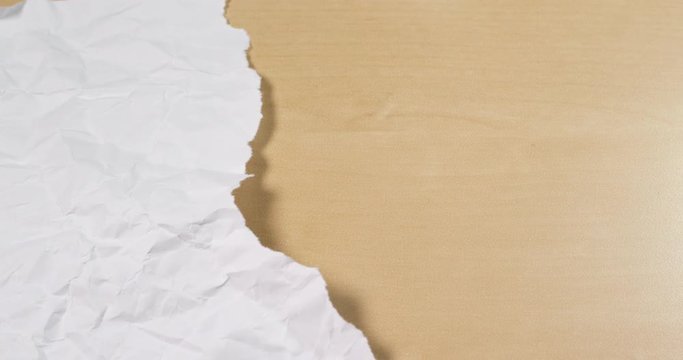 Hand tear off white paper