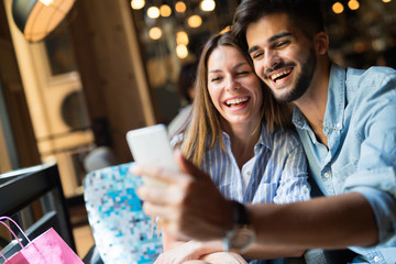 Young attractive couple on date in coffee shop
