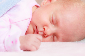 Little newborn baby sleeping in blanket